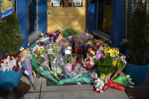 By midday on Saturday, Feb. 20, a memorial formed outside of Jeannie Bird's. Photo by Kyle Parks.