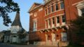 View of McDaniel College theater building and Little Baker Chapel in a sunset