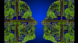 Side profile of two human faces filled with green computer components and technologies, on a blue background.